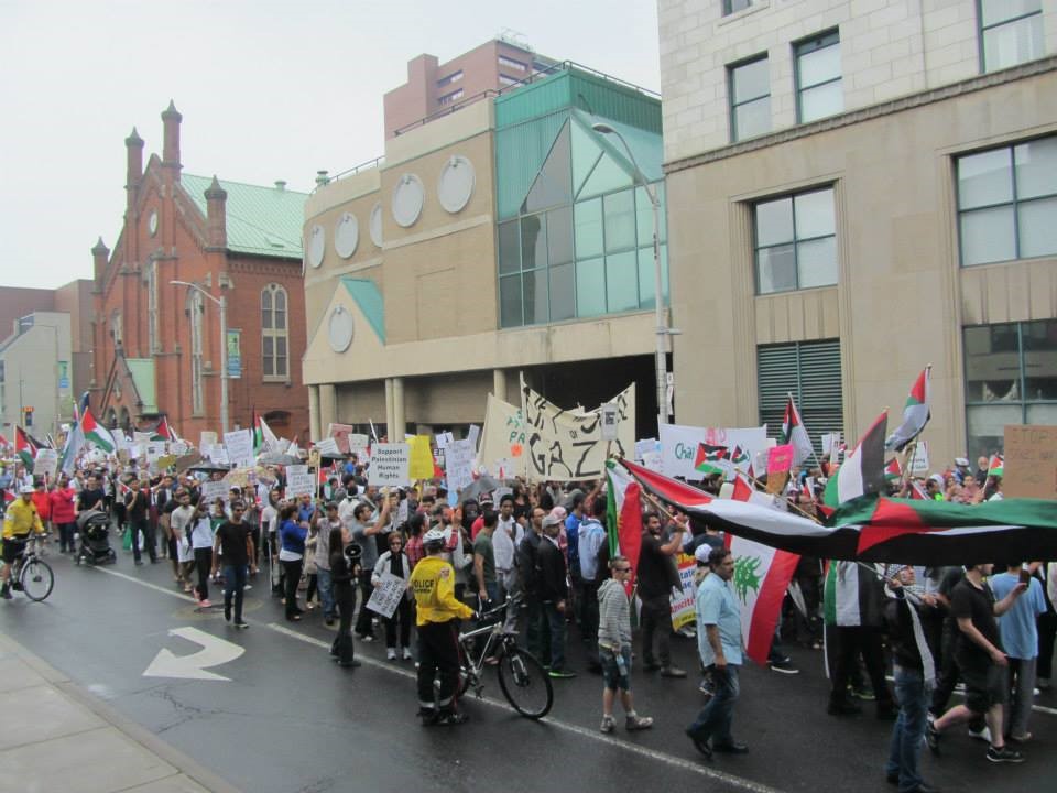 people marching at a rally for Gaza